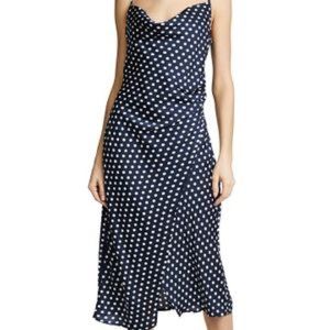 Navy blue satin dress with white polka dots.